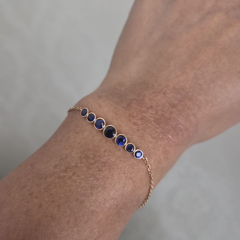 Custom 14K gold graduated sapphire bracelet